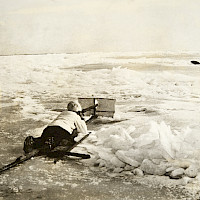 Seal hunter with a seal in view. The picture was taken in the early 1900’s off the island of Replot. Photographer: unknown Archive collection: Finnish Heritage Agency / Ethnographic Picture Collection HK19731119:5344